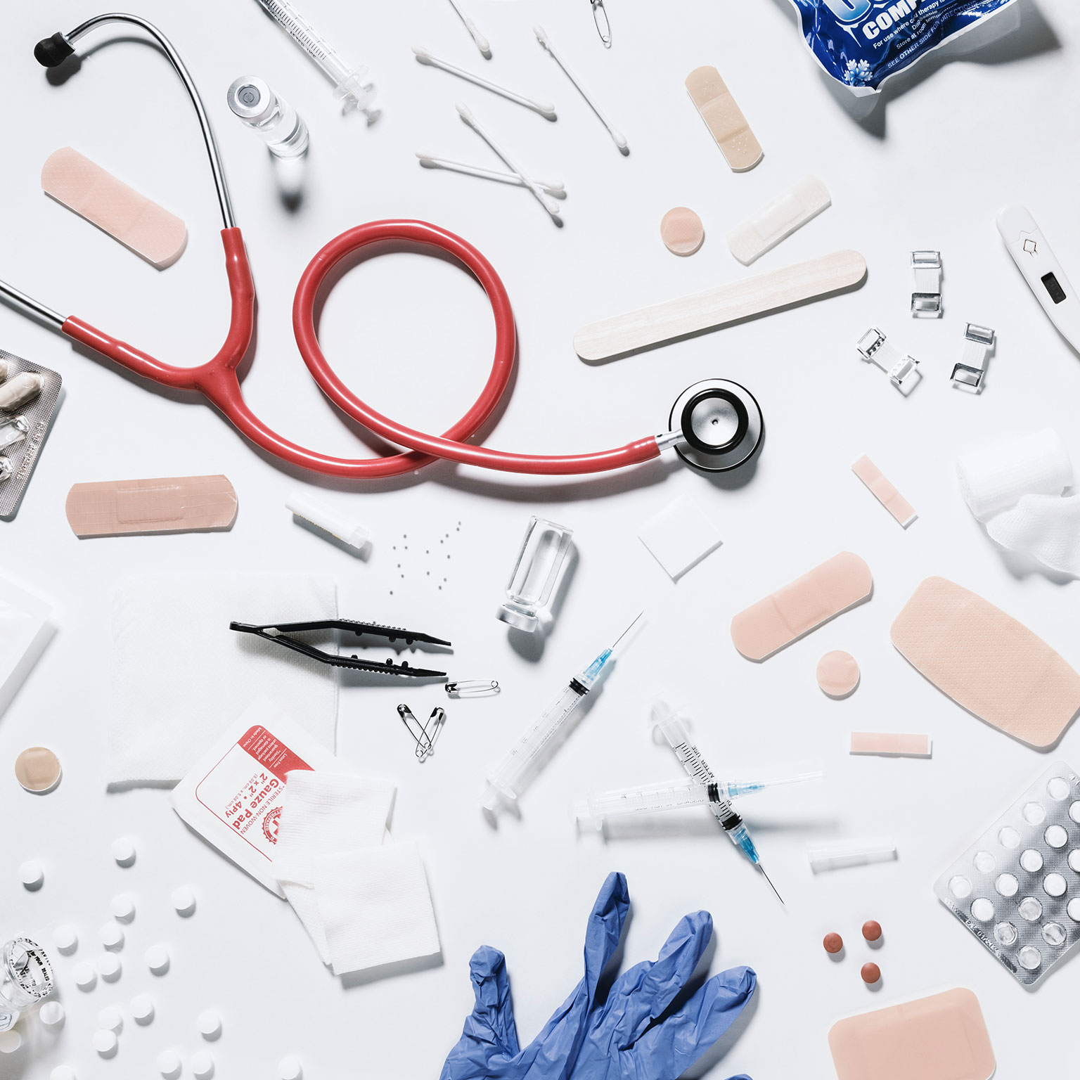 Image of various medical tools on a white table
