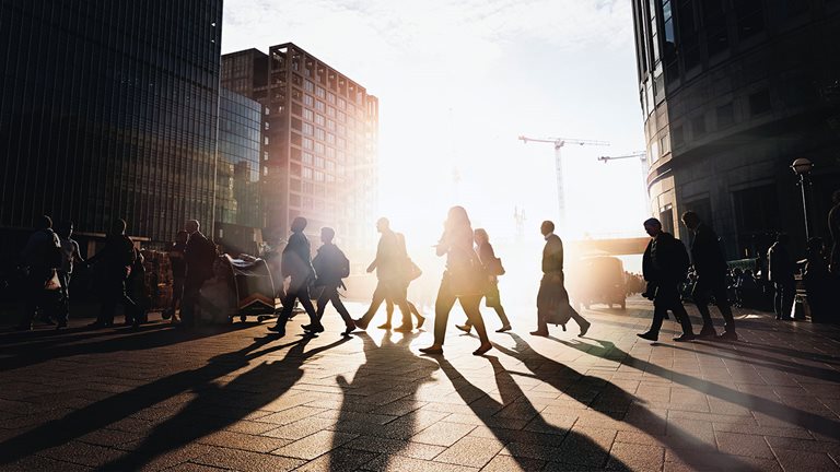 Image of people walking on sunny day
