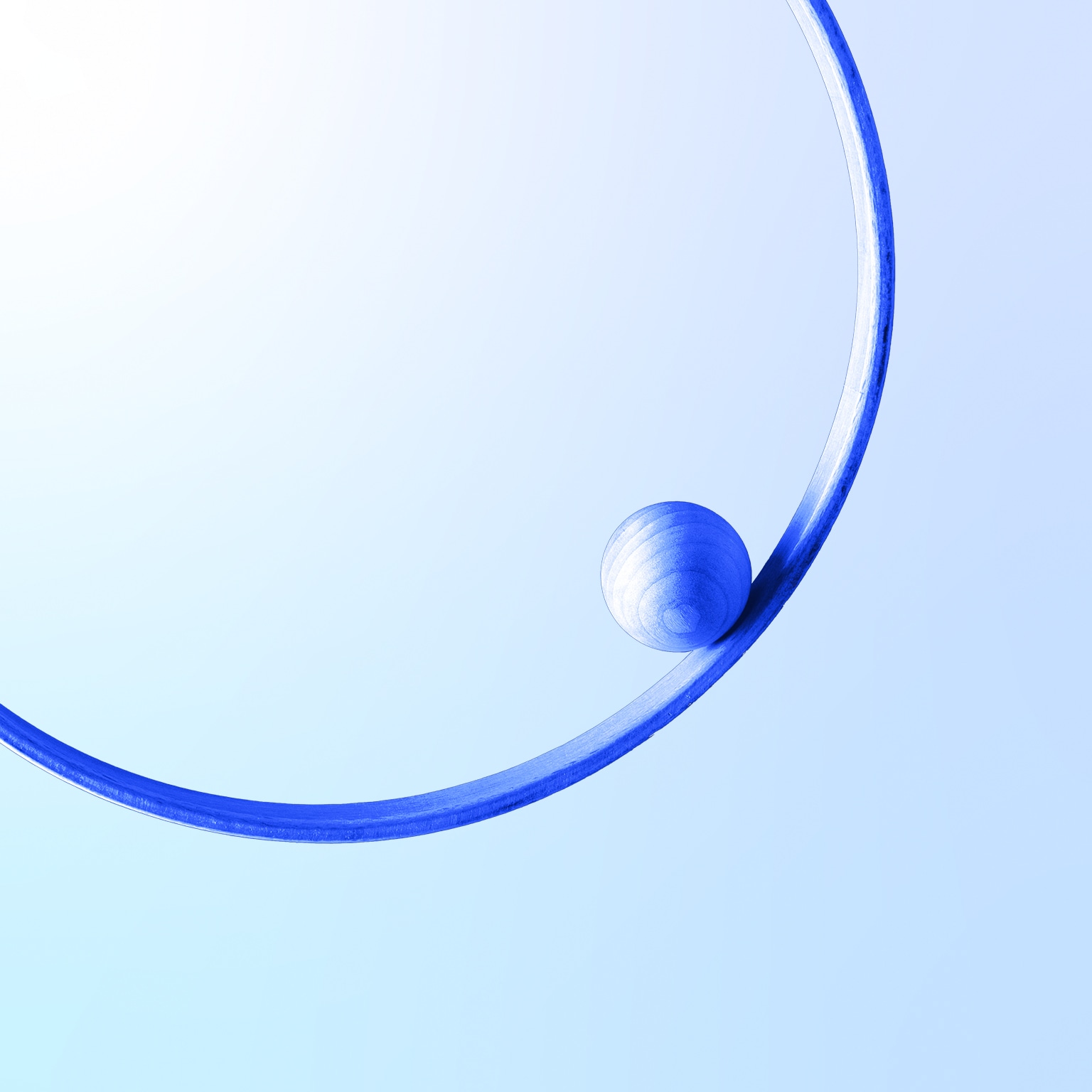 Blue sphere in a blue 3d circle levitation against white colored wall background; balance and concentric concept