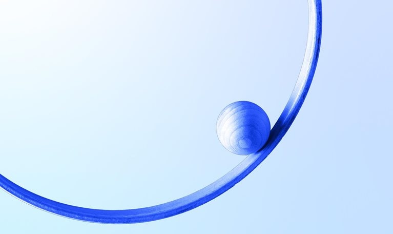 Blue sphere in a blue 3d circle levitation against white colored wall background; balance and concentric concept