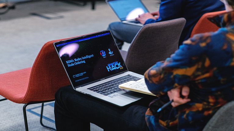 person sitting and working on laptop
