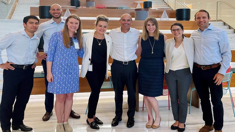 McKinsey global managing partner Bob Sternfels (center), with Laura {to his right) on his visit to the Houston office