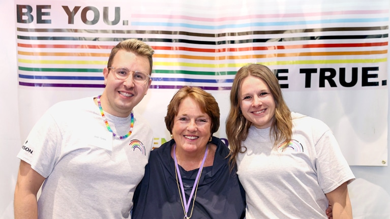 Cindi Love, center, executive director of Out for Undergrad, with students