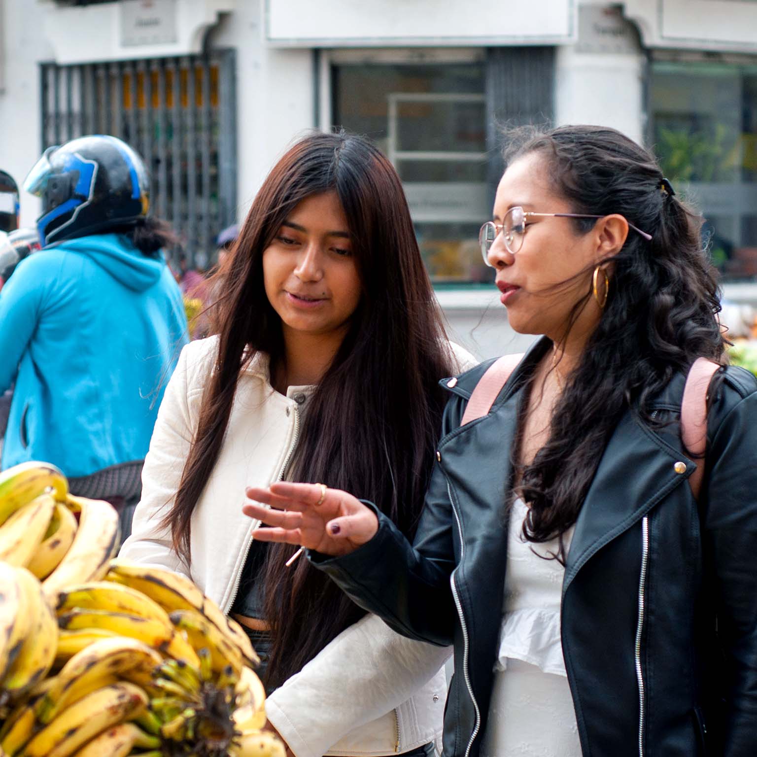 Women shop at an outdoor market