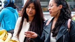 Women shop at an outdoor market
