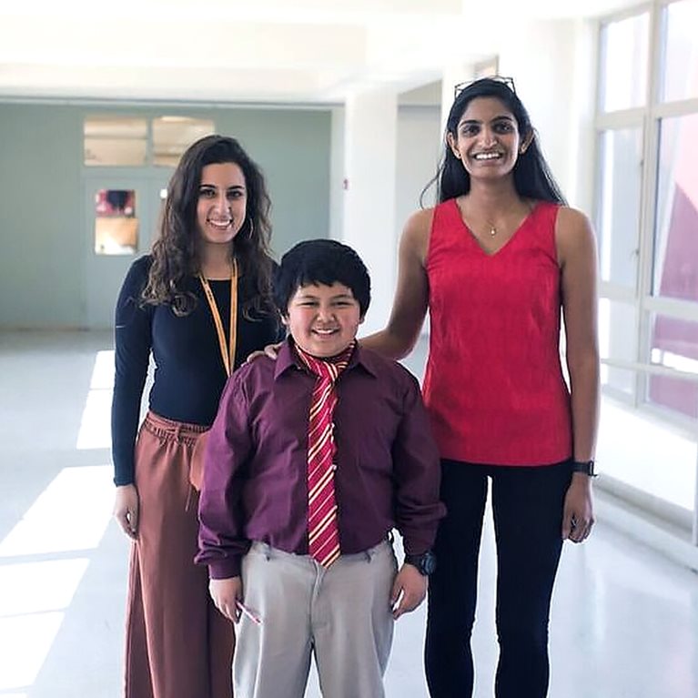 McKinsey associate Nikita Ramanujam (right) at the school where she taught in Oakland, California. 