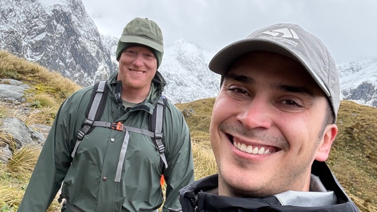Caption: Kirk and his husband Max on a hike.