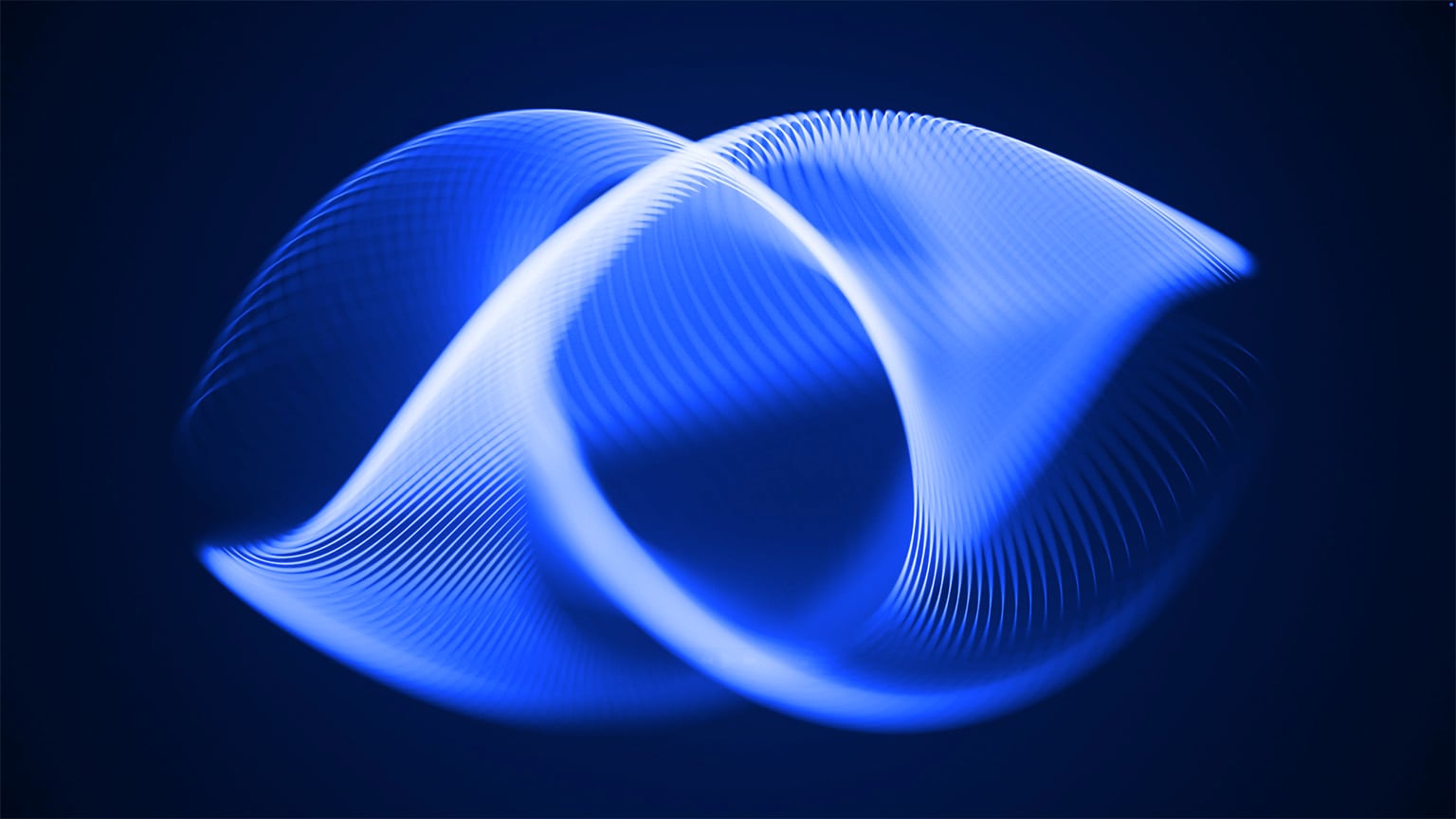 two intersecting illuminating orbs in blue and purple against a black background