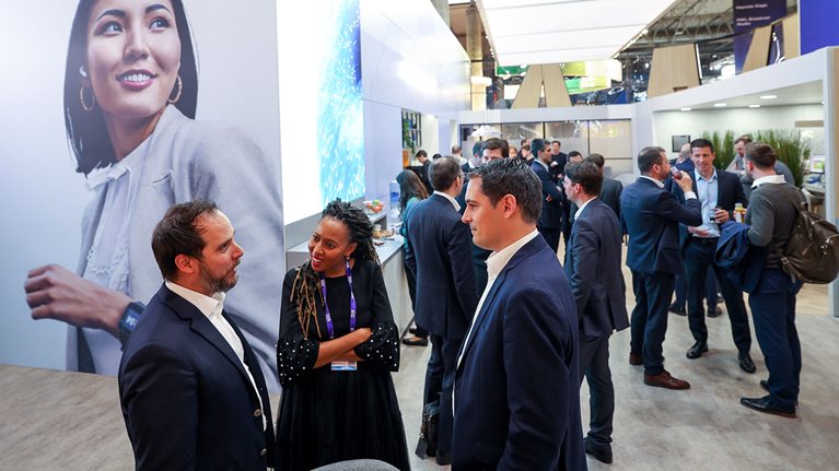 Mobile world congress attendees catch up at the McKinsey stand 