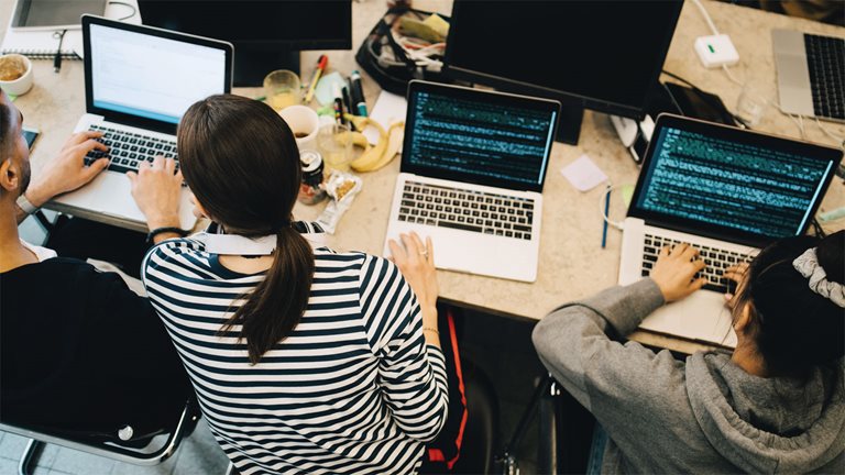 Women working on code.