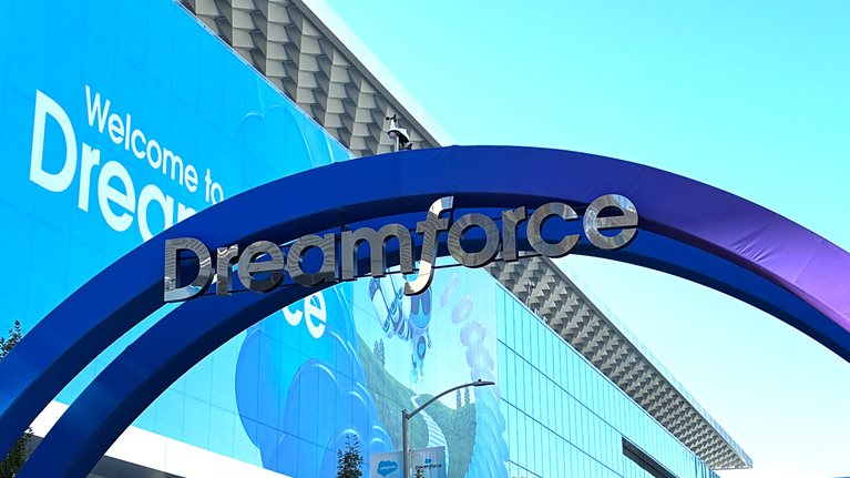 Entrance to Dreamforce, with a large blue arch and “Dreamforce” signage outside the conference venue.