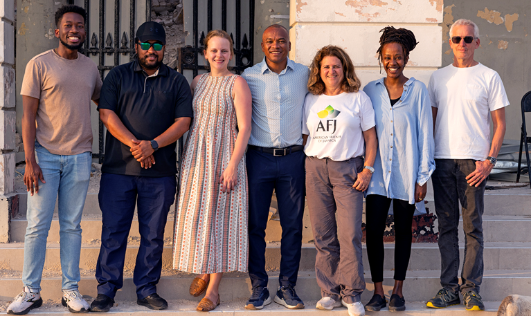 A group of seven people standing side by side
