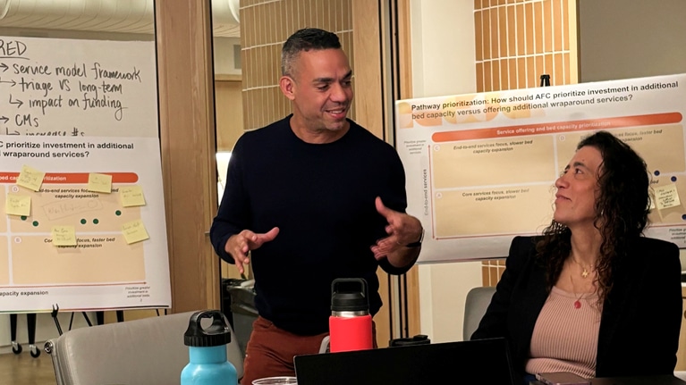 Alex Roque, president and executive director of Ali Forney Center, discussing strategy with McKinsey Partner Dani D’Amico