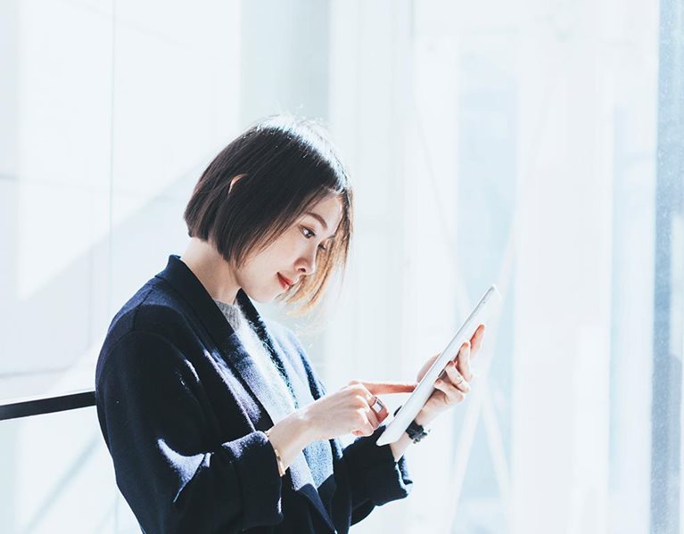 Asian businesswoman with digital tablet