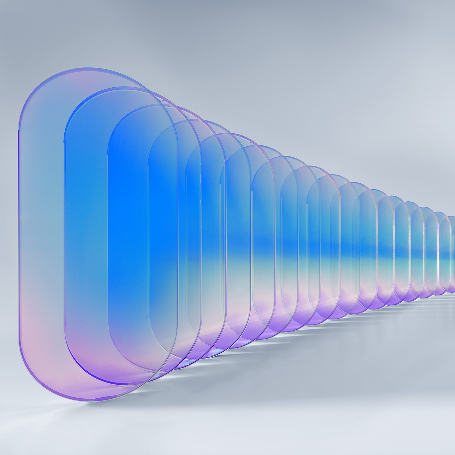 Series of translucent rounded rectangular shapes in blue and purple tones, decreasing in size and receding into the distance against a light gray background.