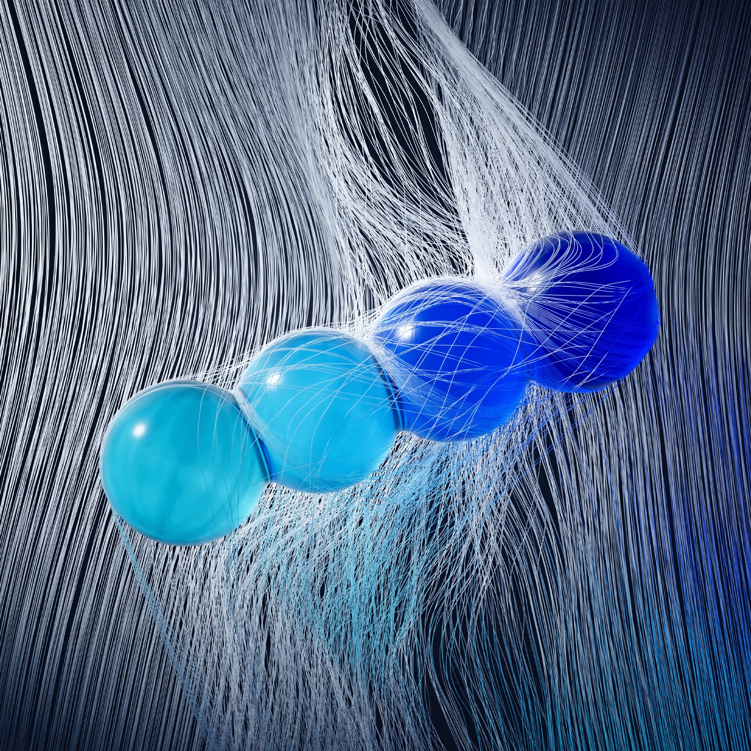 Four glass spheres in varying shades of blue are suspended in midair, tangled in a cascade of fine white threads.