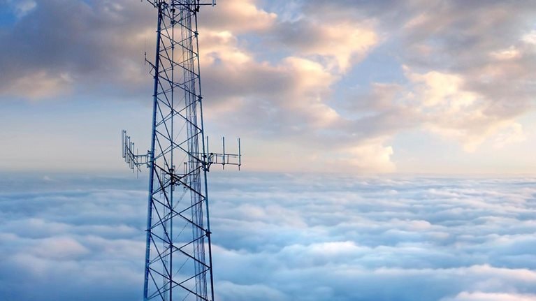 Cellular tower above clouds