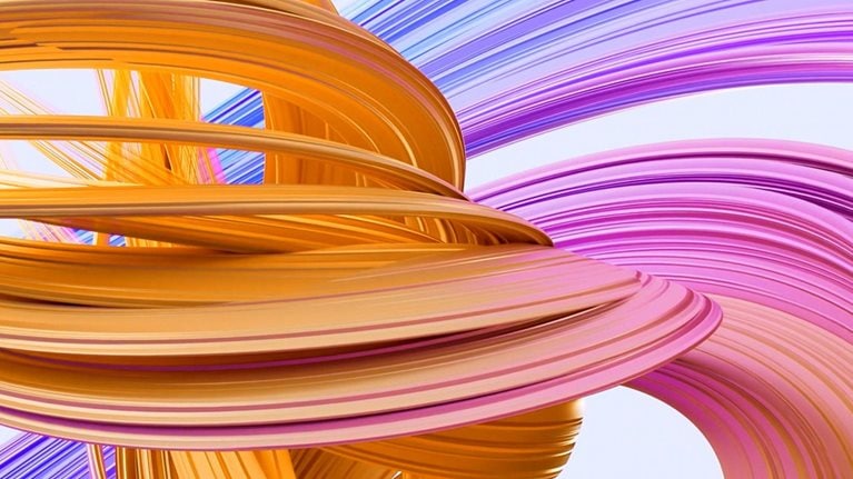 A soft blue backdrop frames a dynamic, three-dimensional display of swirling colors. The shape initially appears as a small, blue form in the upper left corner, but gradually grows in size and incorporates shades of purple and orange as it engulfs the entire screen.