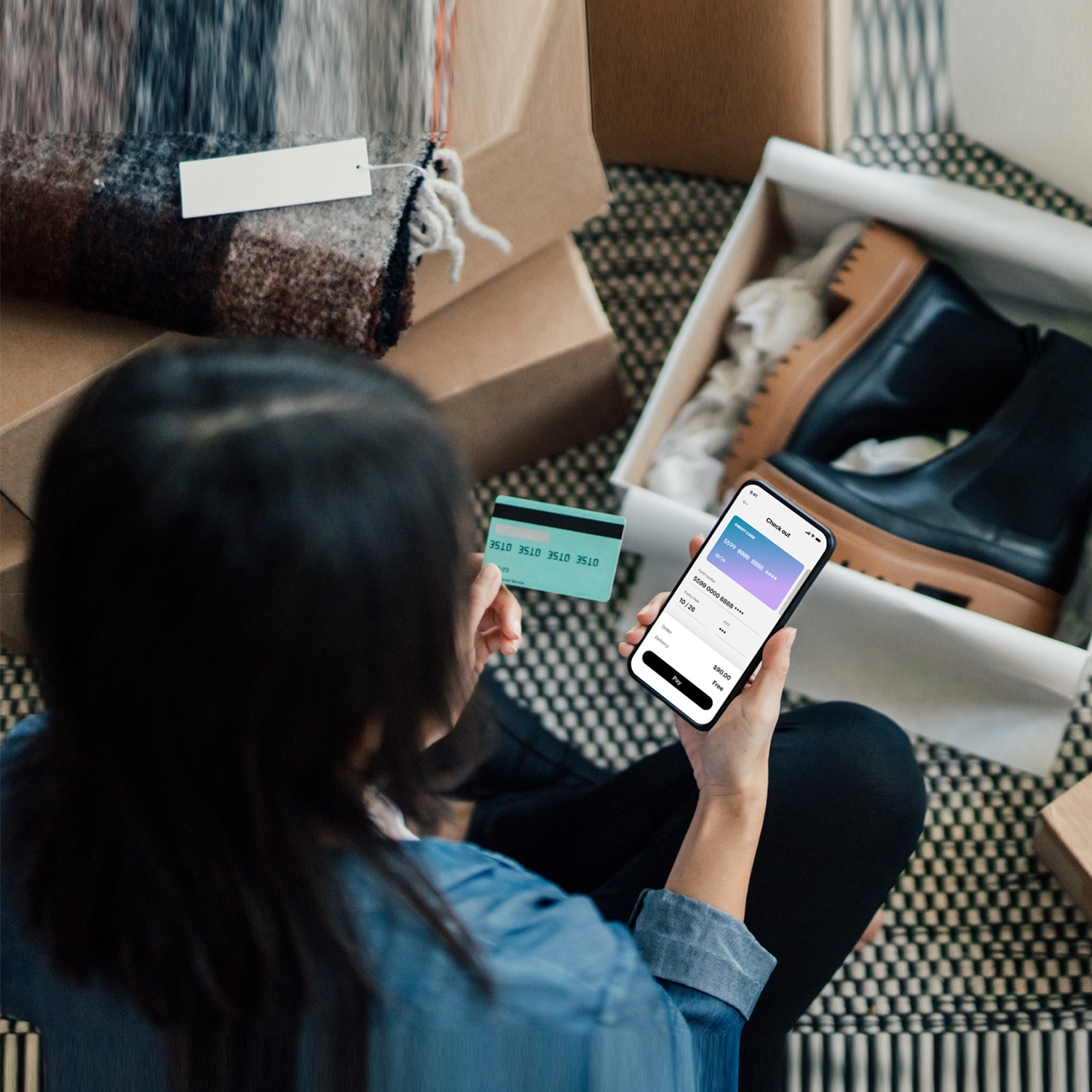 Overhead View Of Young Woman Doing Online Shopping With Smart Phone