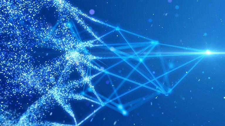 A network of light points culminating in a bright light at one end and on the other end, the other half of the network is expanding by breaking into smaller sparks of light