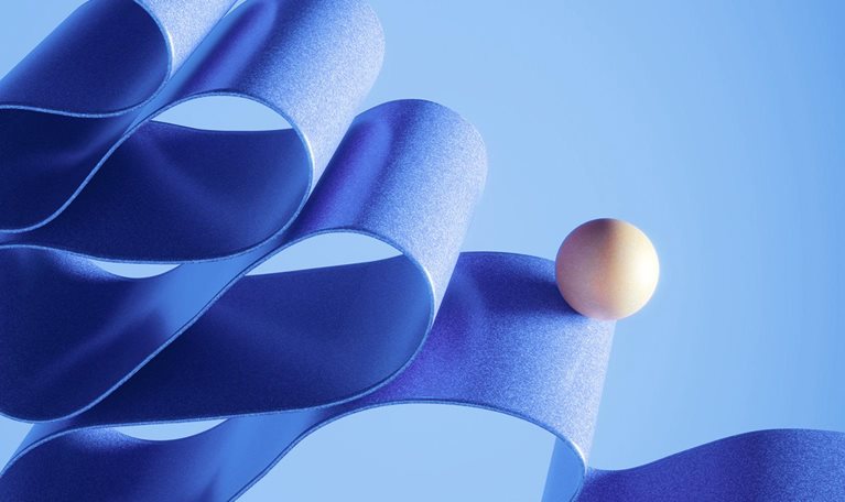 A ball balancing on a twisted ribbon that is running down screen