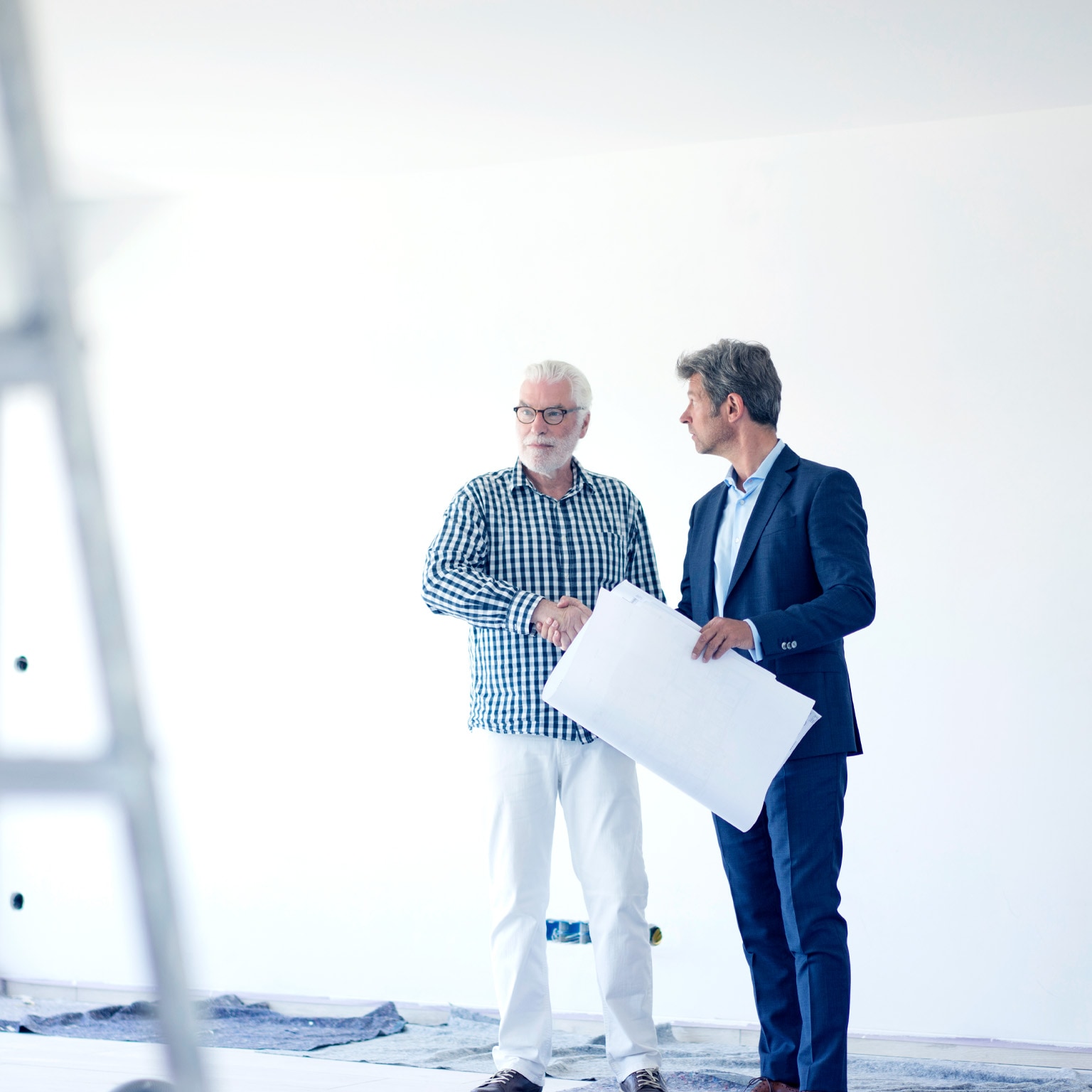 Business people in an office space that is getting remodeled.