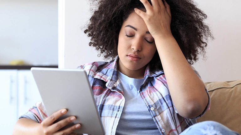Woman With Digital Tablet Having Trouble - stock photo