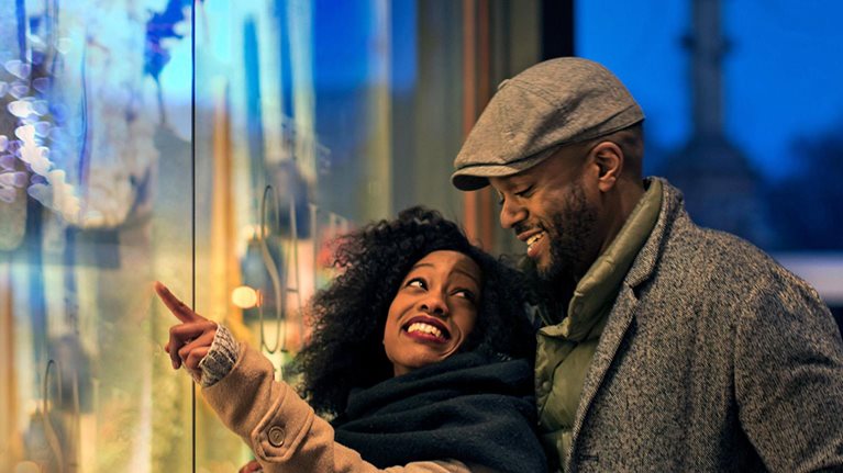 Happy couple window shopping