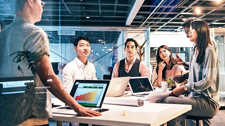 Young Group Of Professionals Developing Business Strategy and Providing The Business Plan