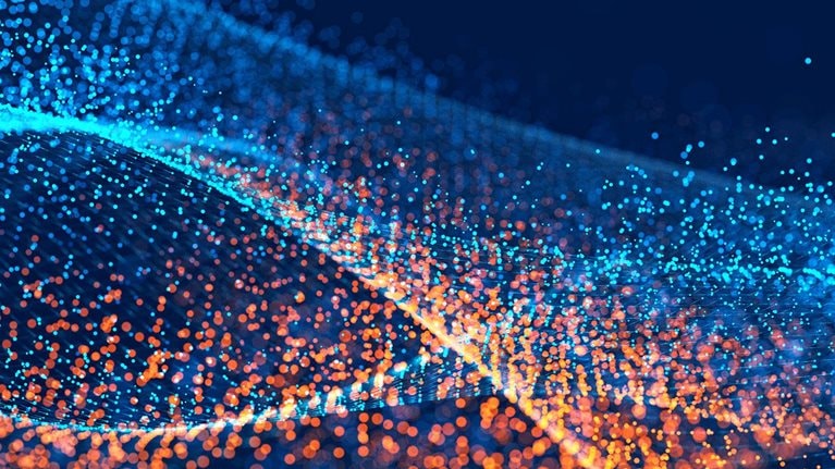 Digital image of waves made of different colored light points