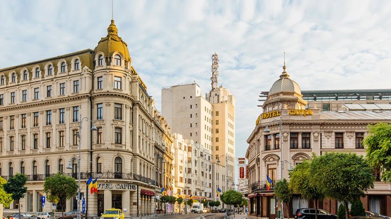 Bucharest street with historic buildings early in the morning, Bucharest, Romania - stock photo