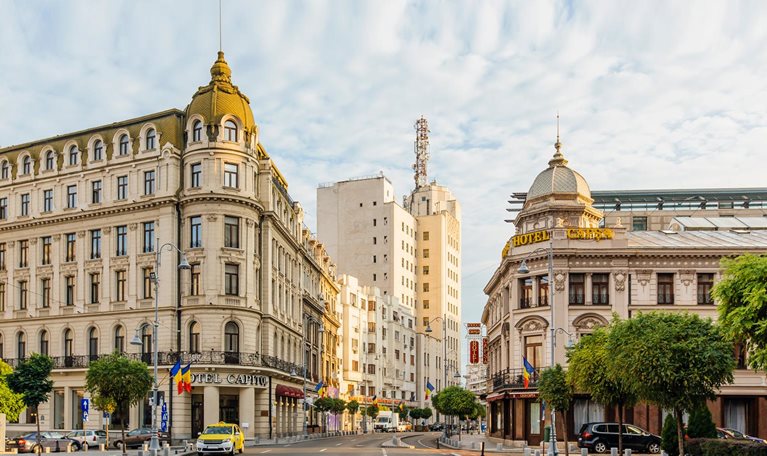 Bucharest street with historic buildings early in the morning, Bucharest, Romania - stock photo