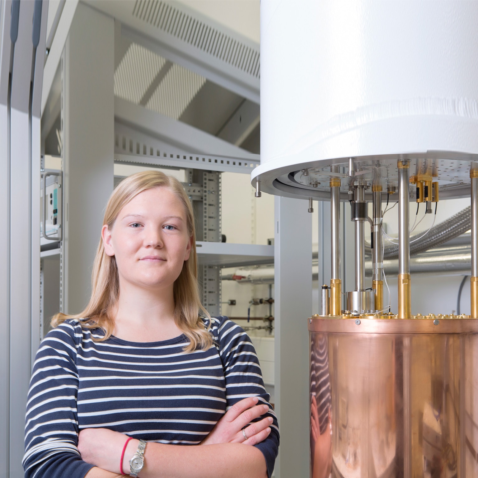 Portrait of a female physicist next to a dilution - stock photo