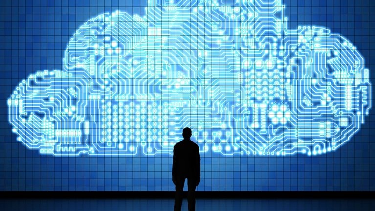 silhouette of man standing in front of digital cloud illustration