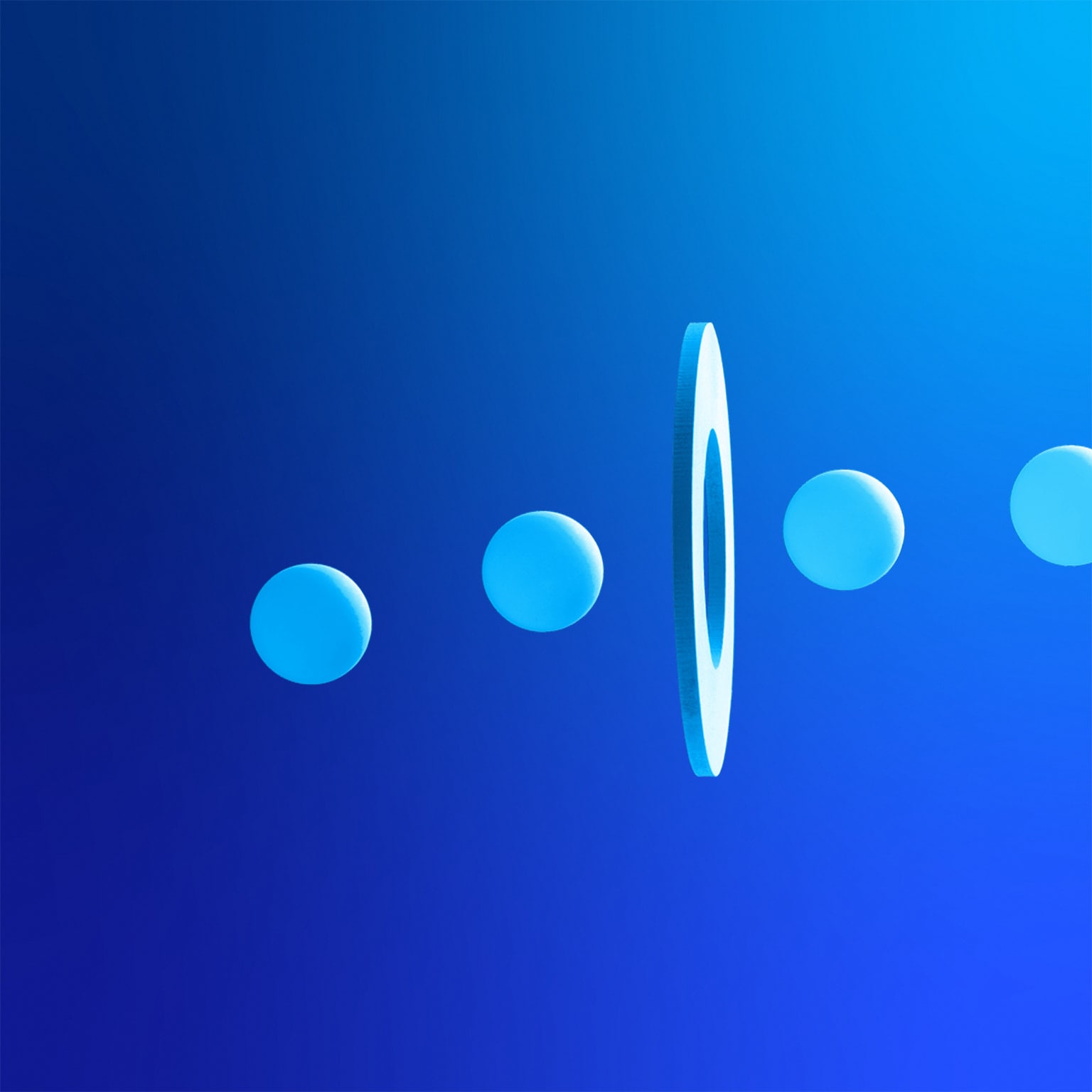 Line of balls going through a hole on floating white disc