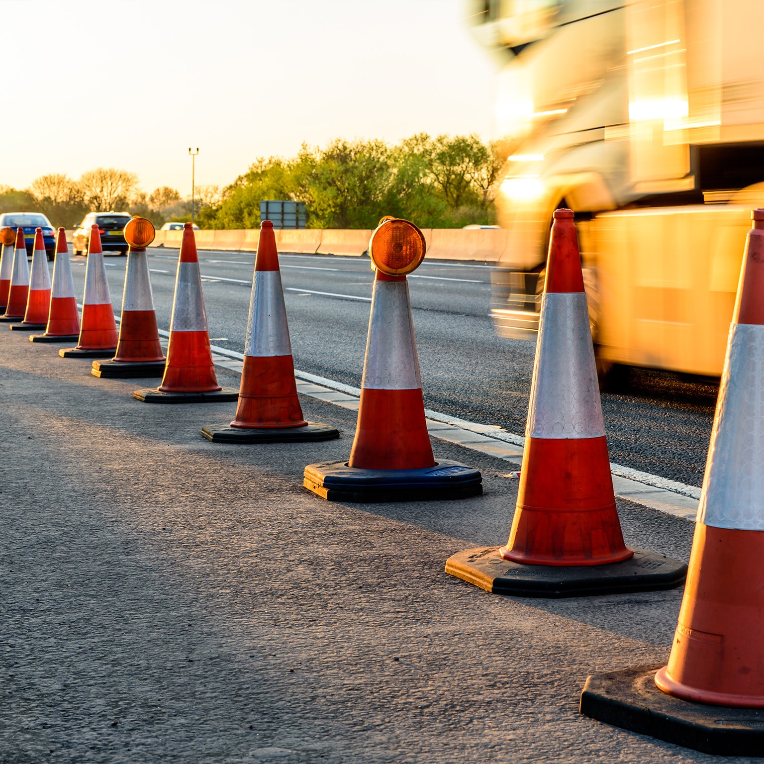 Evening view UK Motorway Services Roadworks Cones - stock photo