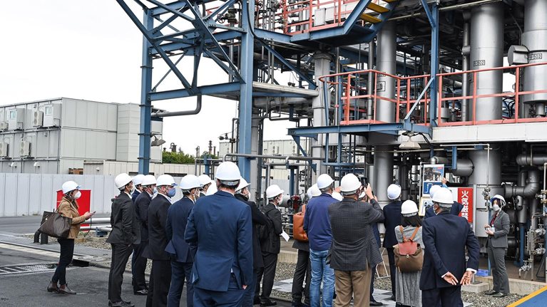 visitors outside Tokyo factory photo