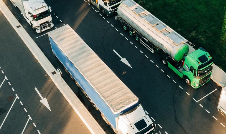 overhead view of hydrogen supply trucks on road photo