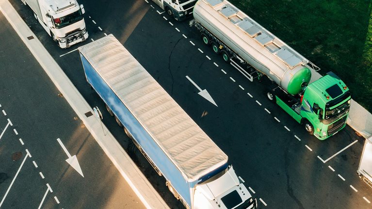 overhead view of hydrogen supply trucks on road photo