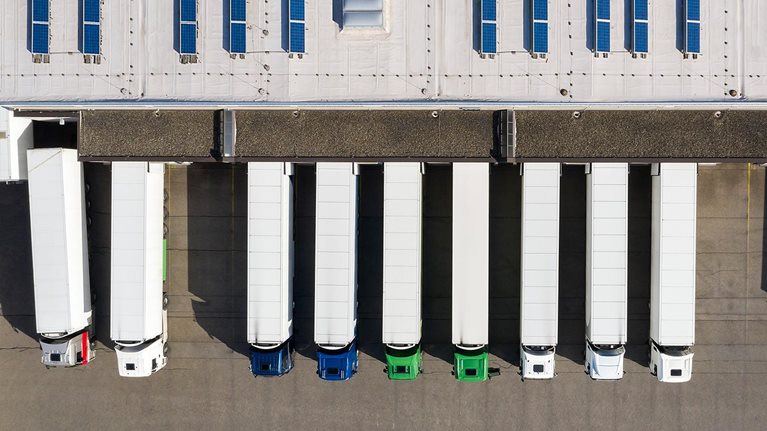 overhead photo of trucks at loading dock