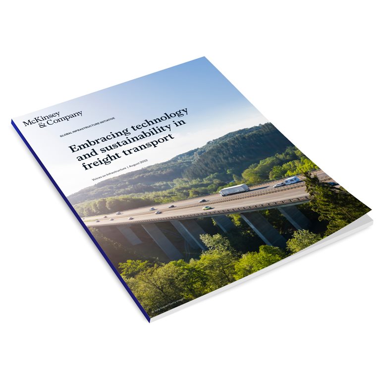 cars and trucks driving over bridge