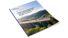 cars and trucks driving over bridge