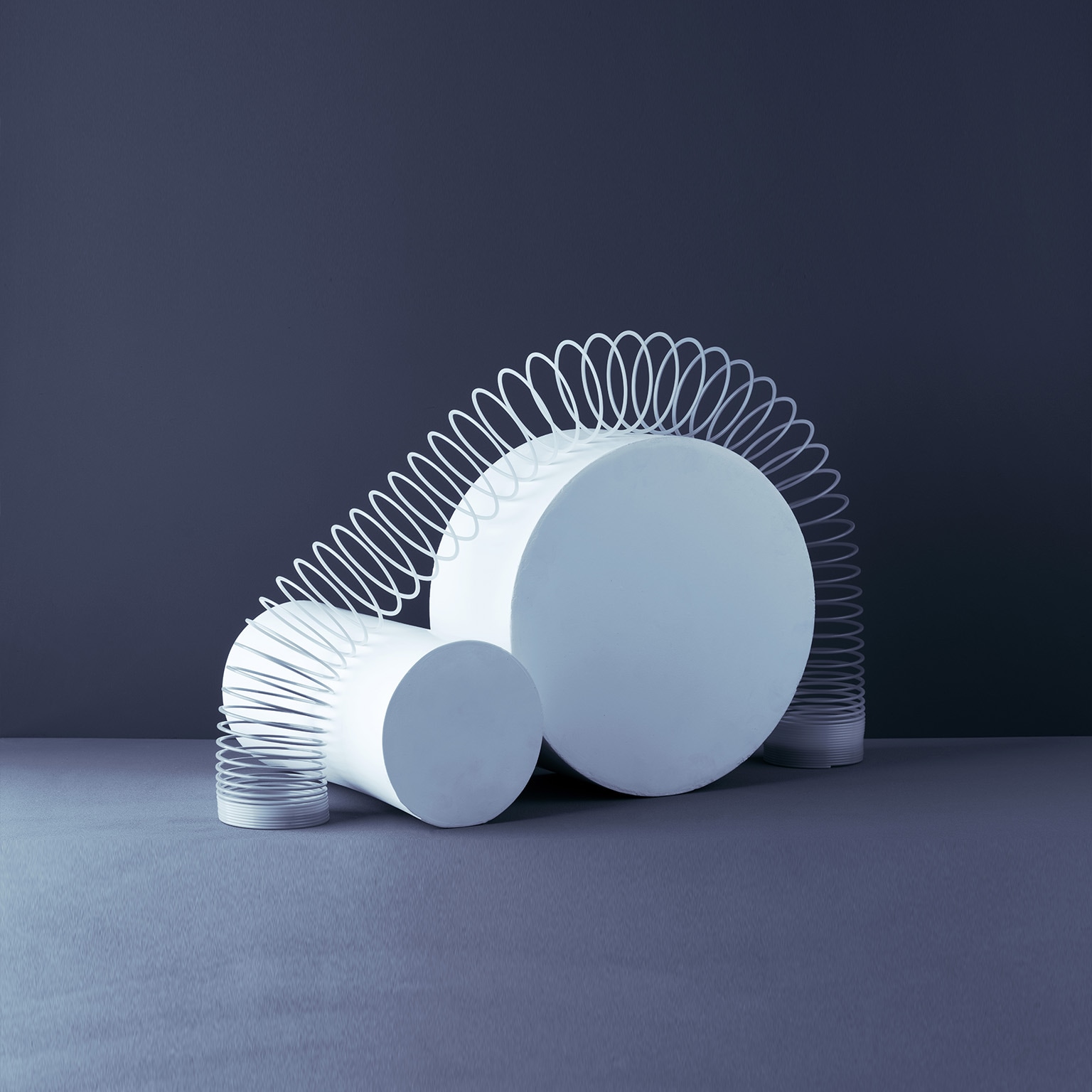 Photo of spring expanding over multiple blocks, representing agility