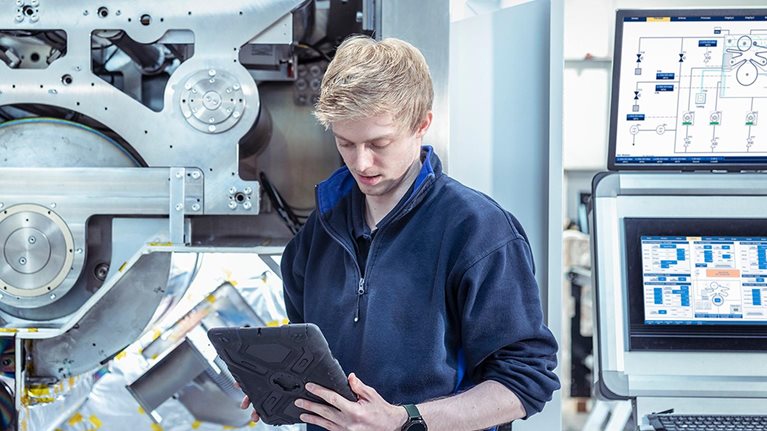 Designer engineer with vacuum coating machine for automotive battery use