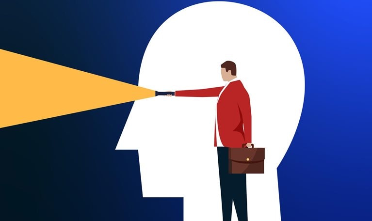 A conceptual illustration of a flat white head framing a person holding a flashlight with the beam shining out of where the eyes of the white head would be.