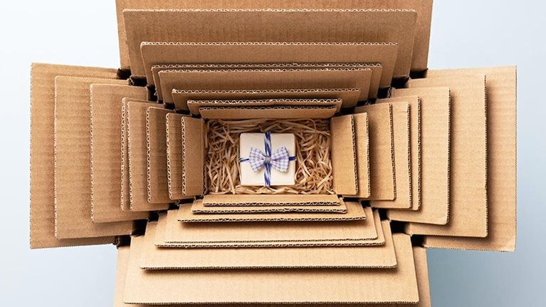 Small Gift Packed in Multiple Cardboard Boxes Nesting, Excessive Packaging