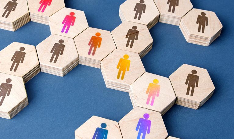 A network or chain of puzzle pieces with people on them