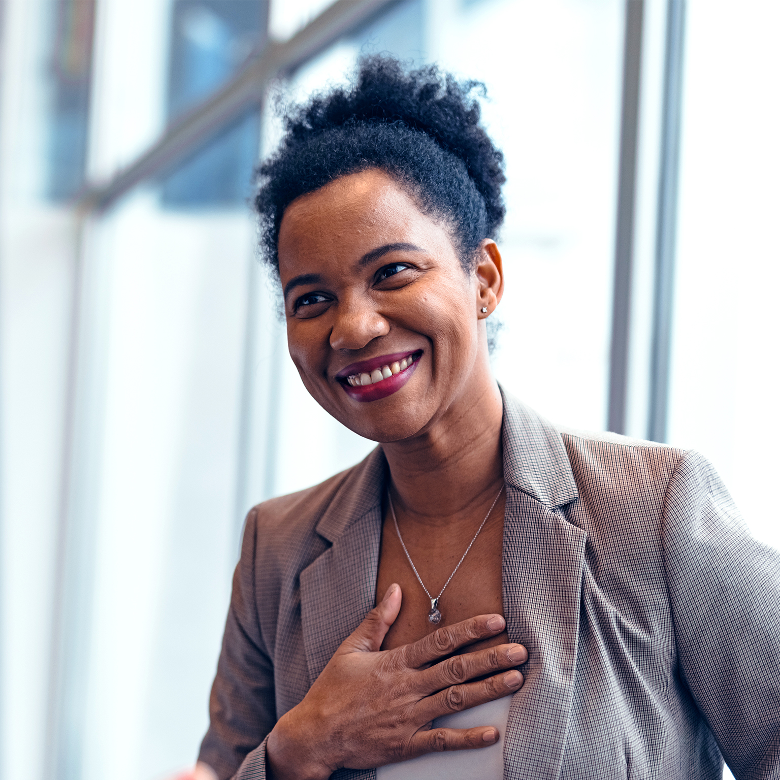  Grateful businesswoman thanking colleague for support and motivation at workplace