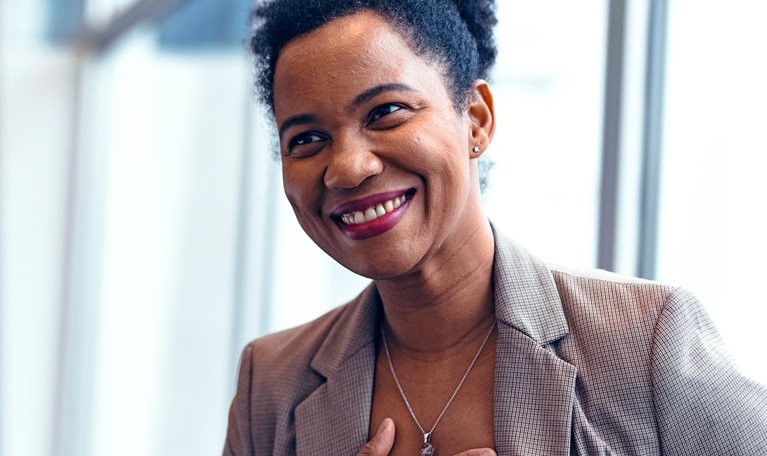 Grateful businesswoman thanking colleague for support and motivation at workplace