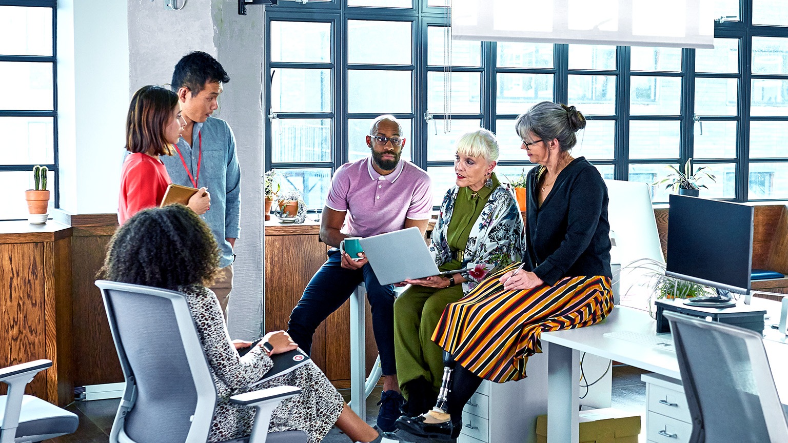 Diverse group of business colleagues having informal meeting